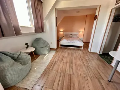 a small room with a bed and a couch at Your Room Primorsko in Primorsko