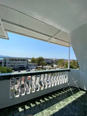 a balcony with a view of a city at Your Room Primorsko in Primorsko