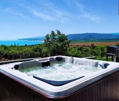 a large bath tub sitting on top of a fence at Villa Meraki in Byala
