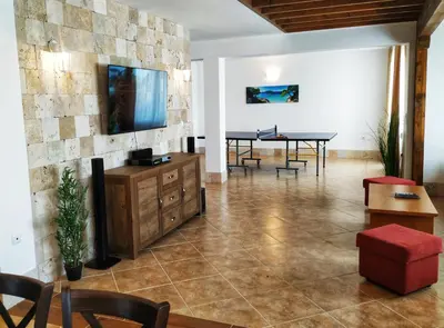 a living room with a table and chairs at Villa Meraki in Byala