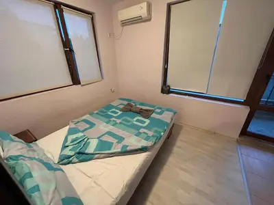 a small room with a bed and a window at Vqra Sarafovo in Burgas City