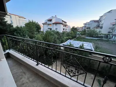 a balcony with a view of a city at Vqra Sarafovo in Burgas City