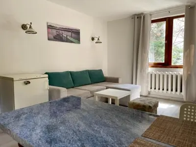 a living room with a couch and a table at Apart Zefira 2 Rooms in Varna City