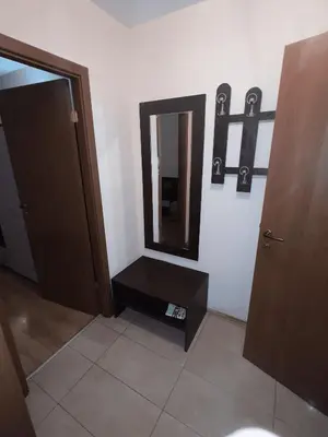 a bathroom with a mirror on the wall and a door at Residence Livi Paradise Sunny Beach! 2 plus 1 - 600m away from the beach in Sunny Beach