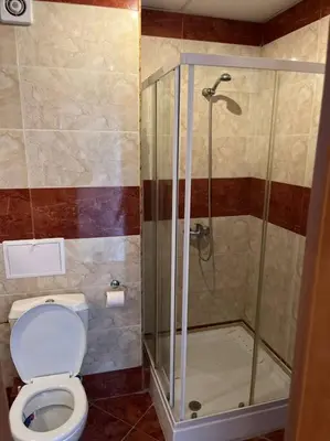 a bathroom with a toilet and a shower at Modern 1 Bed Apt, Nesebar Fort in Sunny Beach