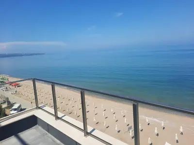 a view of a beach with chairs and the ocean at Diamond Beach Luxus Apart Obzor 28 in Obzor